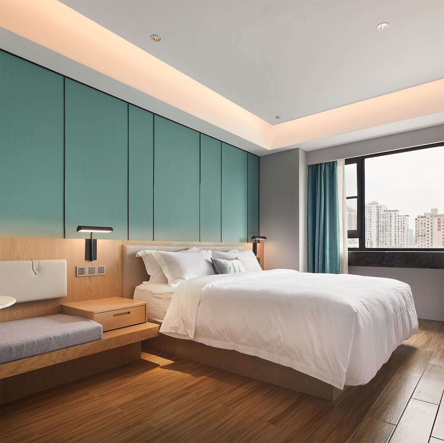 Contemporary hotel bedroom furniture bed and wooden joinery..png